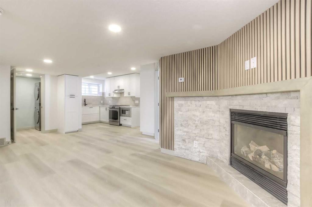 81 Coventry Circle Ne, Calgary, AB - Indoor Photo Showing Living Room With Fireplace