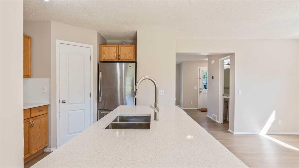 23 Taralake Road Ne, Calgary, AB - Indoor Photo Showing Kitchen With Double Sink