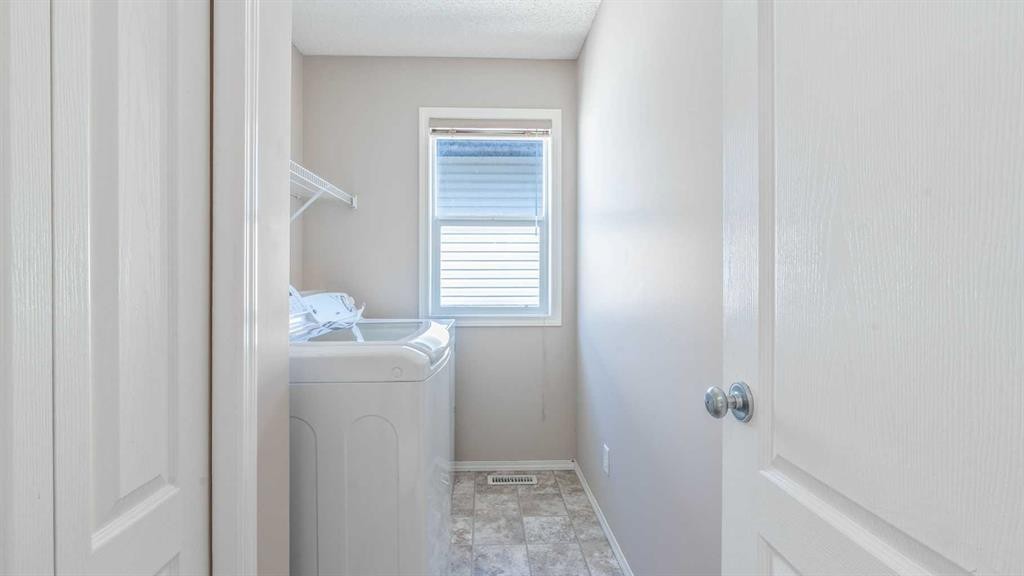 23 Taralake Road Ne, Calgary, AB - Indoor Photo Showing Laundry Room
