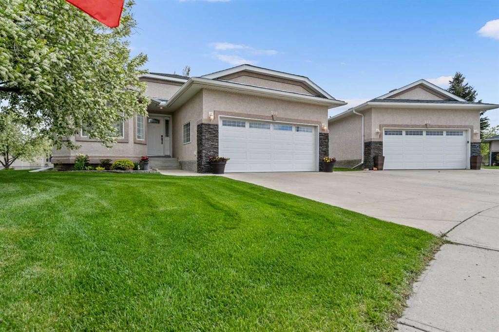 310 Riverside Garden Nw, High River, AB - Outdoor With Facade