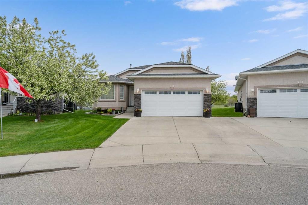 310 Riverside Garden Nw, High River, AB - Outdoor With Facade