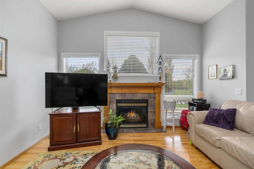 310 Riverside Garden Nw, High River, AB - Indoor Photo Showing Living Room With Fireplace