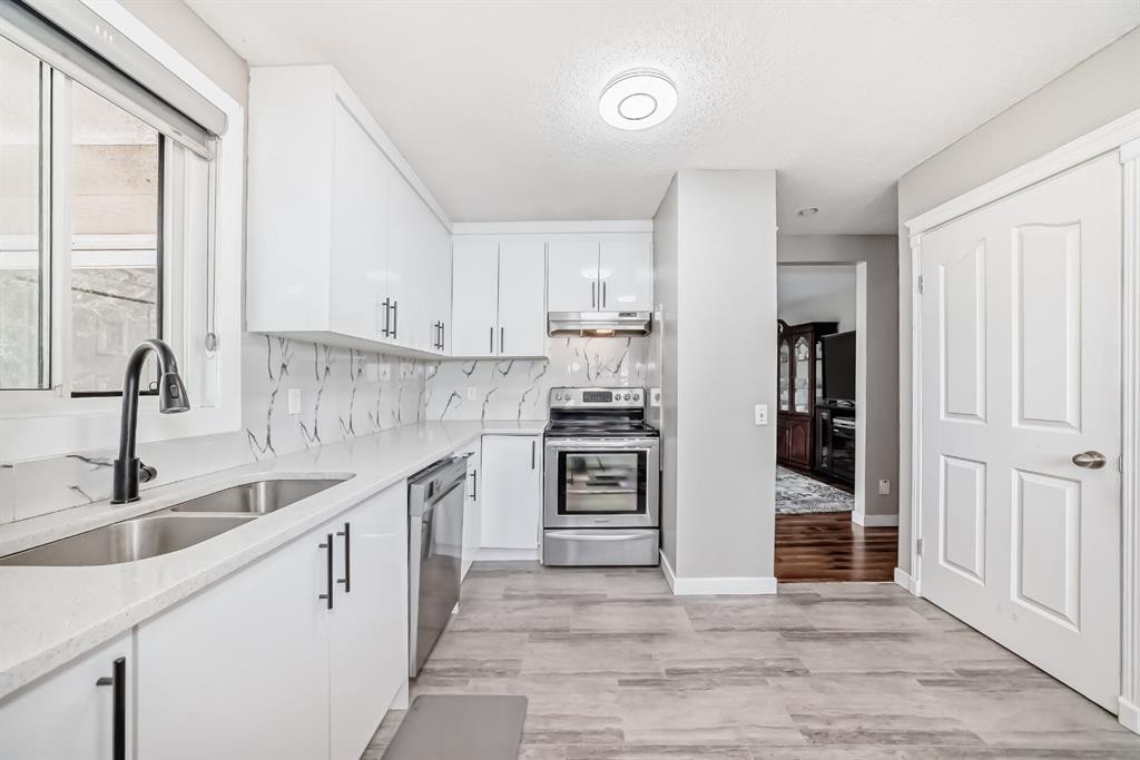 116 Pineson Place Ne, Calgary, AB - Indoor Photo Showing Kitchen With Double Sink
