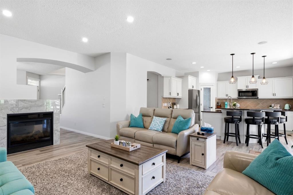 212 Willowmere Close, Chestermere, AB - Indoor Photo Showing Living Room With Fireplace