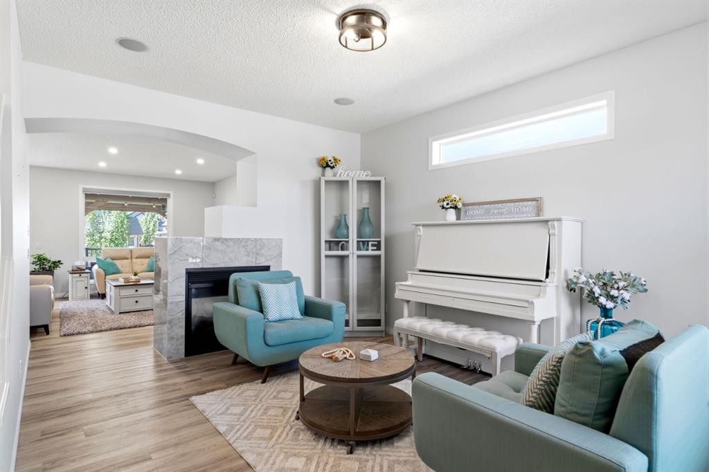 212 Willowmere Close, Chestermere, AB - Indoor Photo Showing Living Room With Fireplace