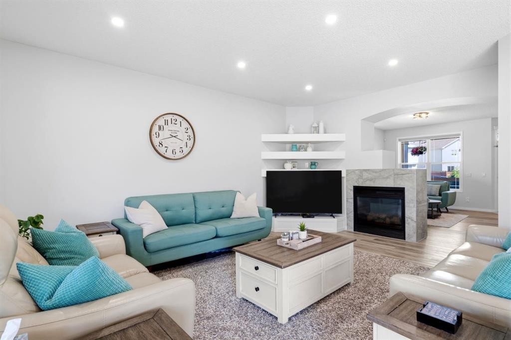 212 Willowmere Close, Chestermere, AB - Indoor Photo Showing Living Room With Fireplace
