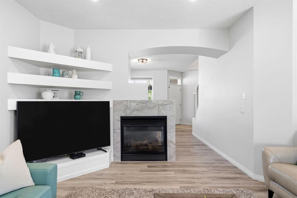 212 Willowmere Close, Chestermere, AB - Indoor Photo Showing Living Room With Fireplace