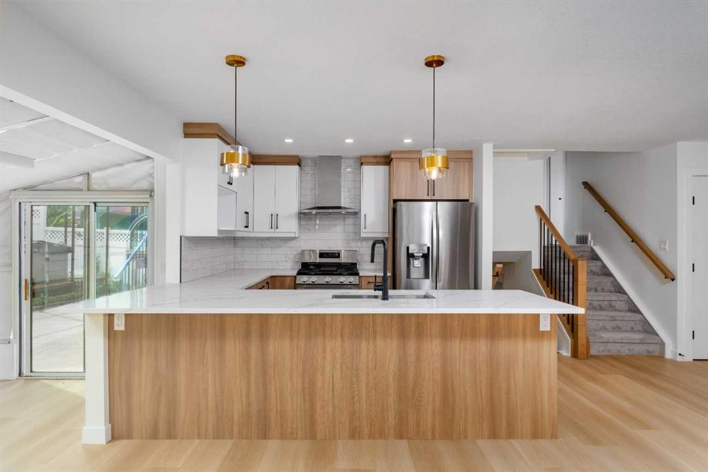 312 Queensland Road Se, Calgary, AB - Indoor Photo Showing Kitchen With Upgraded Kitchen