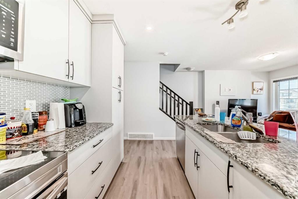 1387 148 Avenue Nw, Calgary, AB - Indoor Photo Showing Kitchen With Double Sink With Upgraded Kitchen