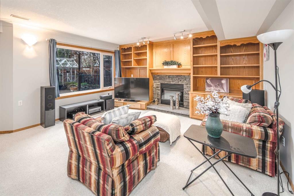 37 Arbour Summit Close Nw, Calgary, AB - Indoor Photo Showing Living Room With Fireplace