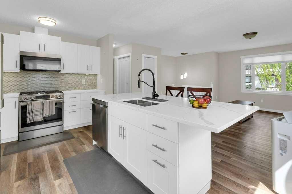 120 Alpine Crescent Se, Airdrie, AB - Indoor Photo Showing Kitchen With Double Sink With Upgraded Kitchen