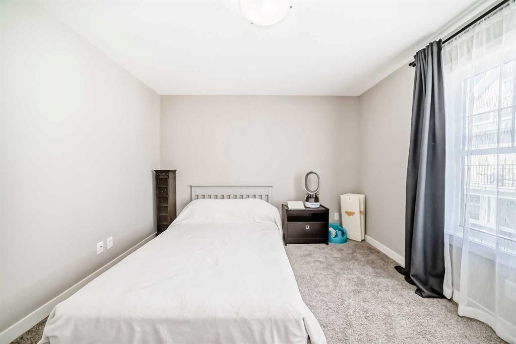 410 Cranbrook Walk Se, Calgary, AB - Indoor Photo Showing Bedroom