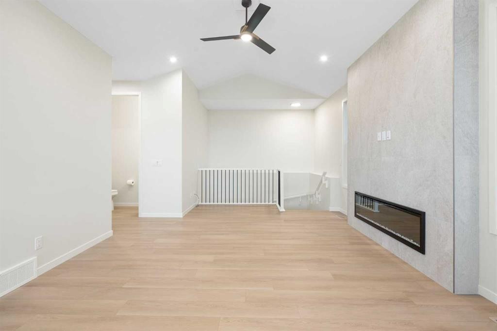 147 Marmot Grove Nw, Calgary, AB - Indoor Photo Showing Other Room With Fireplace