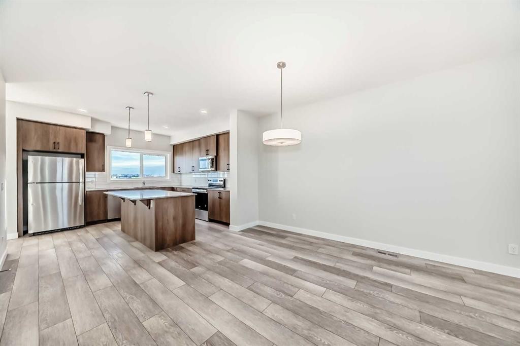 241 Bridgeport Gate, Chestermere, AB - Indoor Photo Showing Kitchen With Upgraded Kitchen