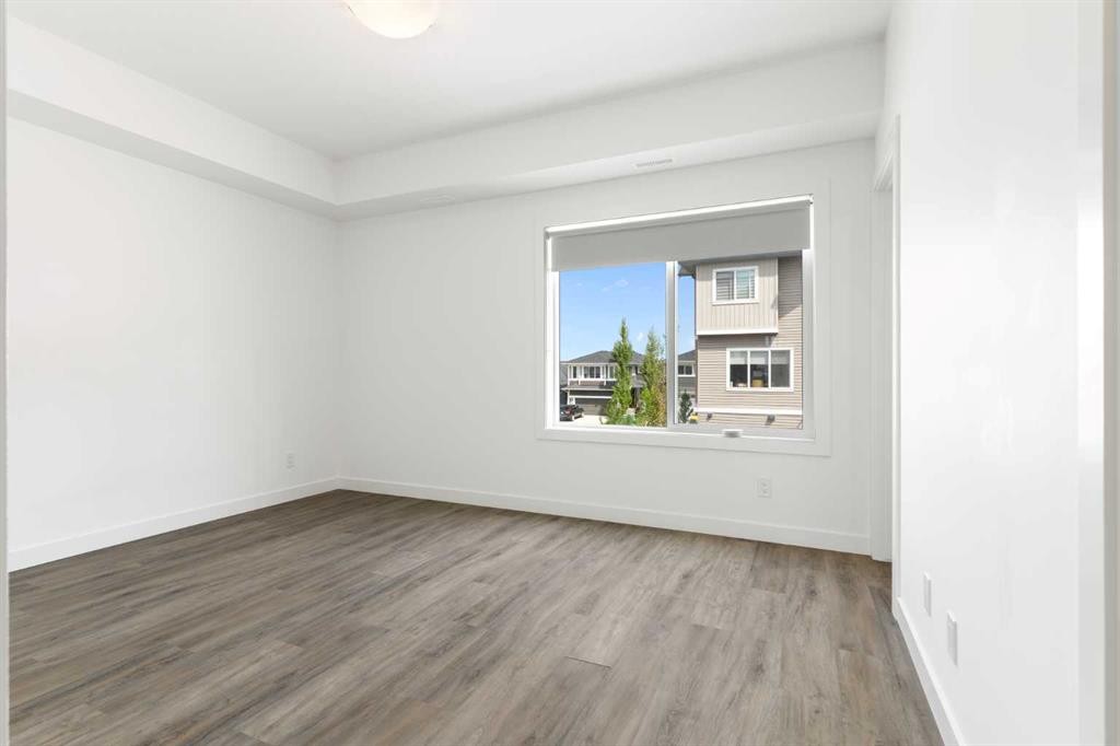 401-24 Rivercrest Drive, Cochrane, AB - Indoor Photo Showing Other Room
