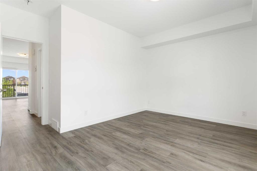 401-24 Rivercrest Drive, Cochrane, AB - Indoor Photo Showing Other Room