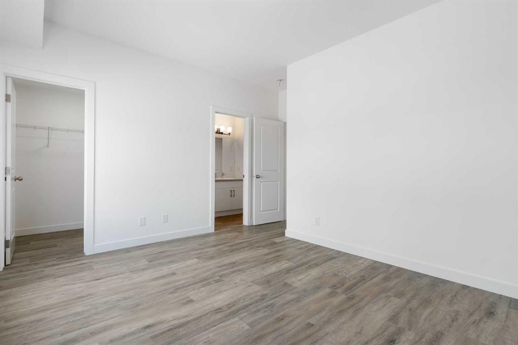 401-24 Rivercrest Drive, Cochrane, AB - Indoor Photo Showing Other Room