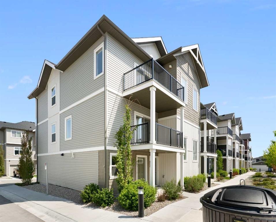 401-24 Rivercrest Drive, Cochrane, AB - Outdoor With Facade