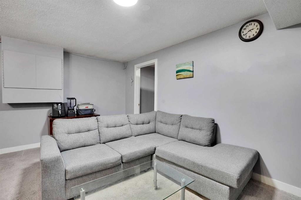 133 Martinglen Way Ne, Calgary, AB - Indoor Photo Showing Living Room