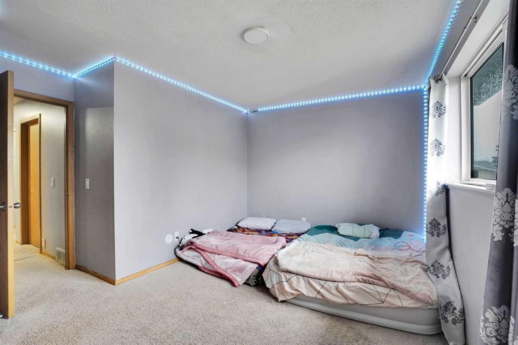133 Martinglen Way Ne, Calgary, AB - Indoor Photo Showing Bedroom