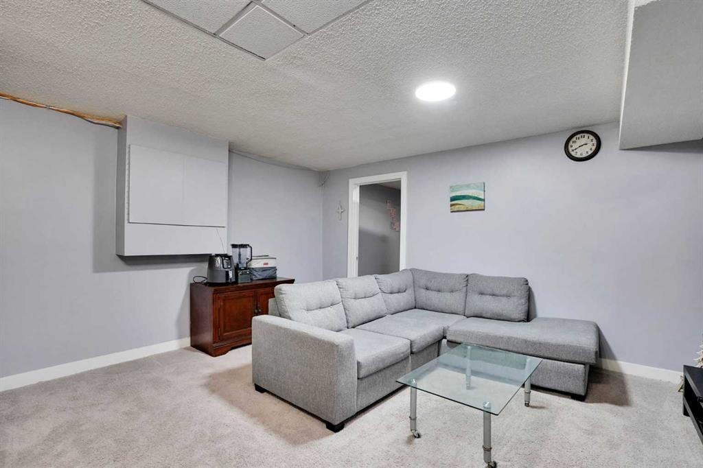 133 Martinglen Way Ne, Calgary, AB - Indoor Photo Showing Living Room