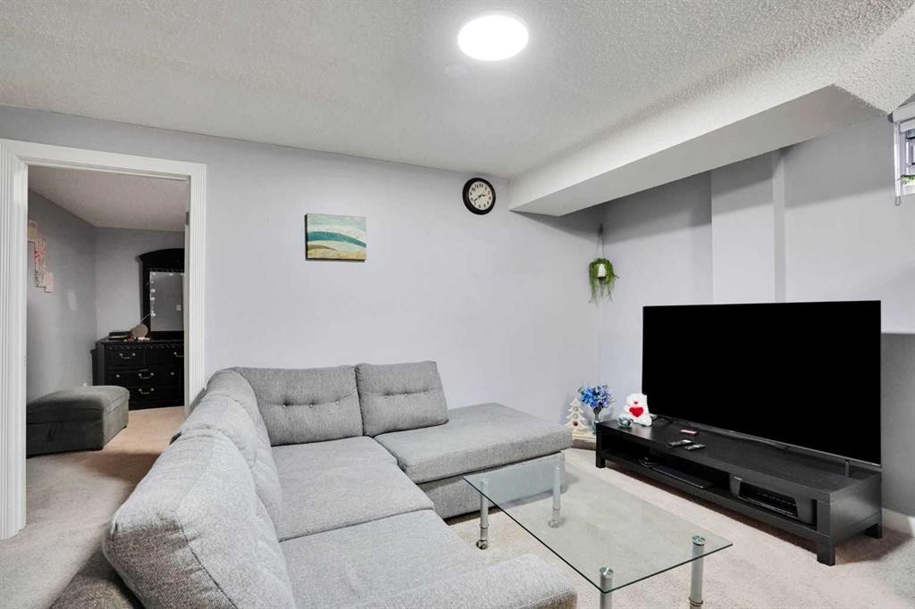 133 Martinglen Way Ne, Calgary, AB - Indoor Photo Showing Living Room