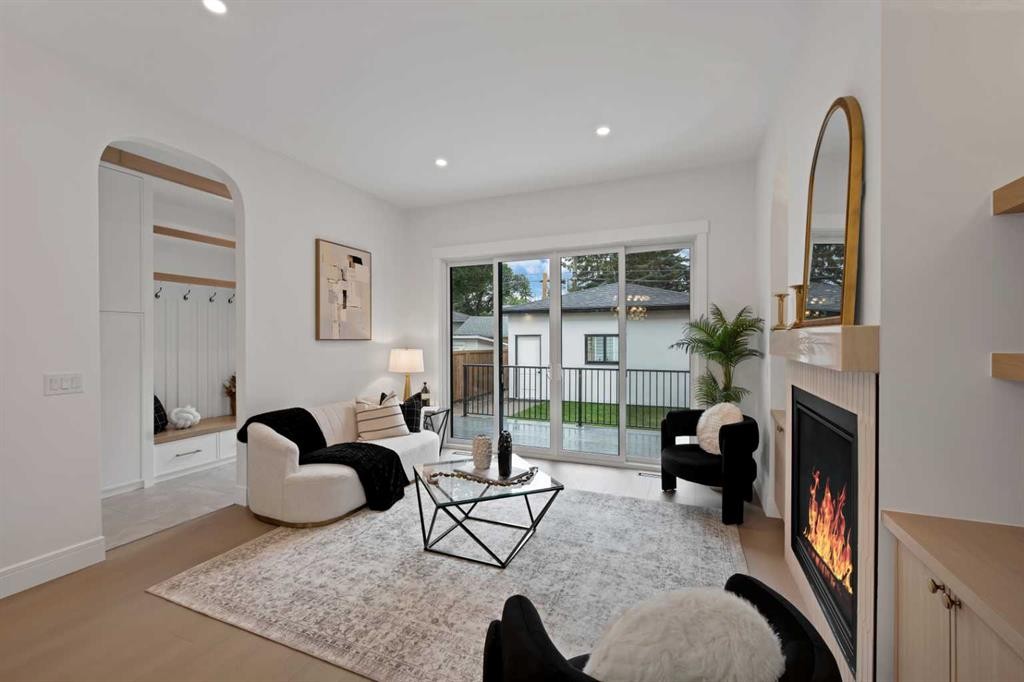 2221 Halifax Crescent Nw, Calgary, AB - Indoor Photo Showing Living Room With Fireplace