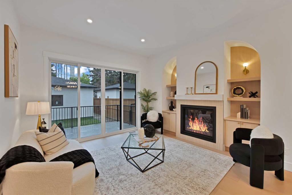 2221 Halifax Crescent Nw, Calgary, AB - Indoor Photo Showing Living Room With Fireplace