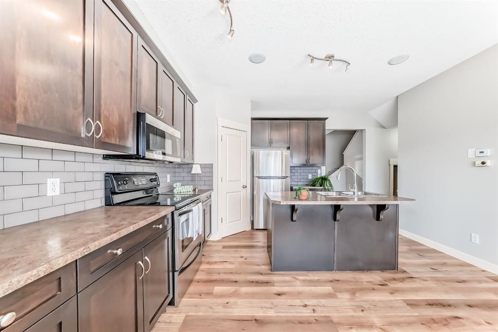 237 Rainbow Falls Drive, Chestermere, AB - Indoor Photo Showing Kitchen With Upgraded Kitchen