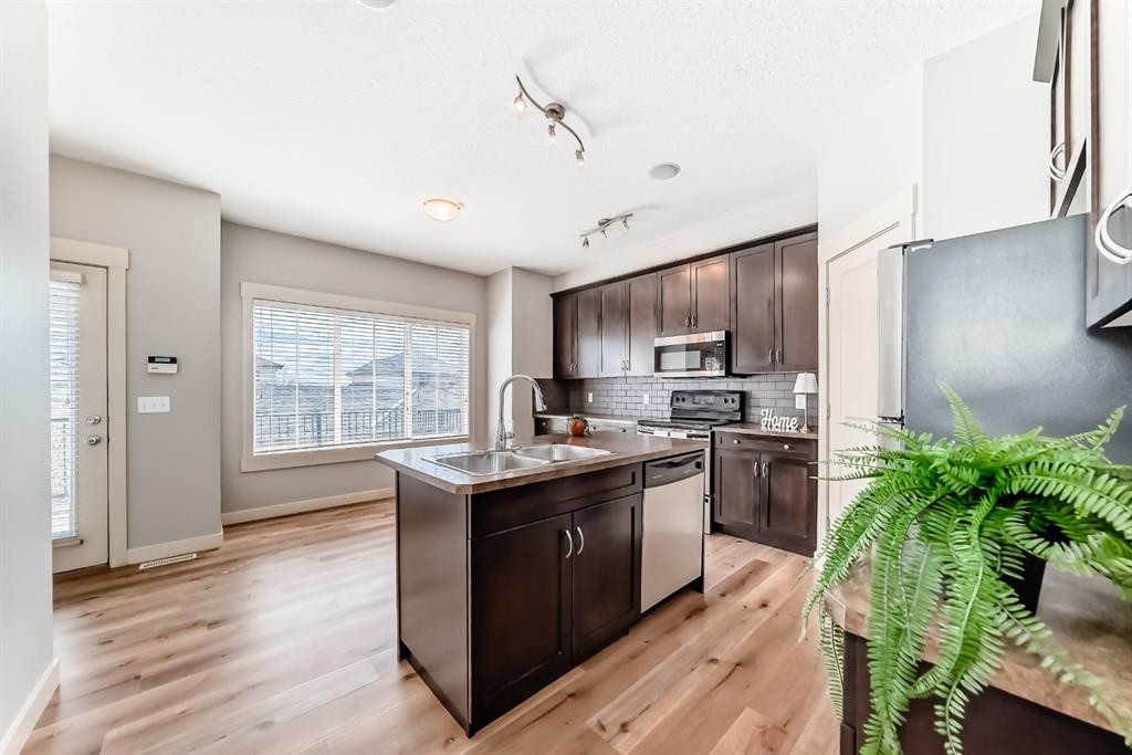 237 Rainbow Falls Drive, Chestermere, AB - Indoor Photo Showing Kitchen With Double Sink