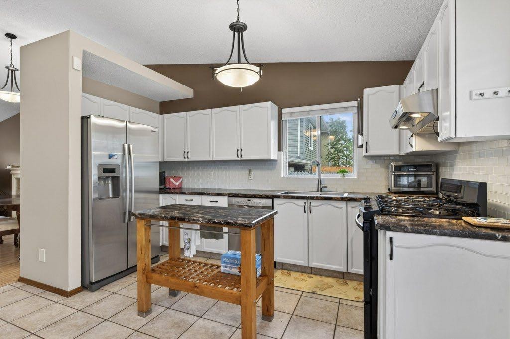 156 Rivercroft Close Se, Calgary, AB - Indoor Photo Showing Kitchen With Double Sink