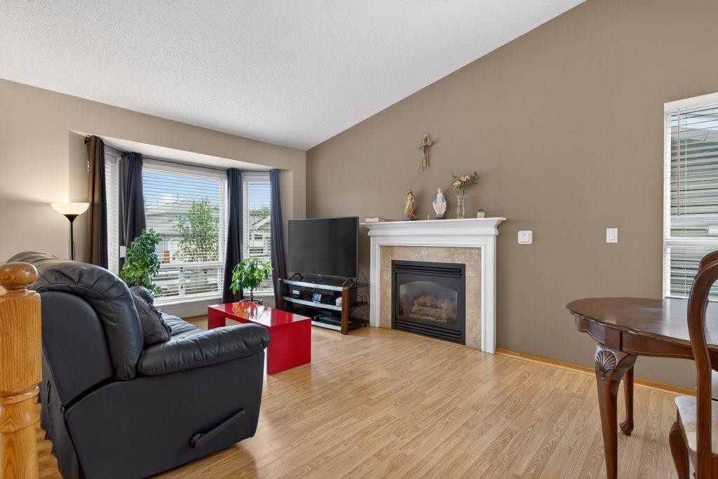 156 Rivercroft Close Se, Calgary, AB - Indoor Photo Showing Living Room With Fireplace