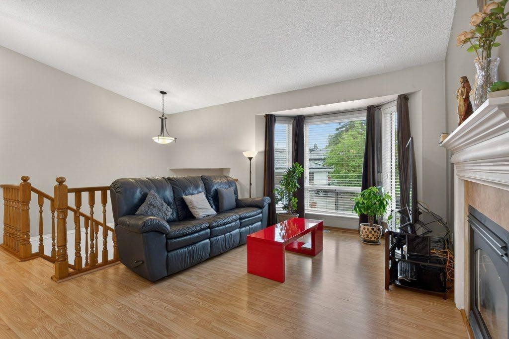 156 Rivercroft Close Se, Calgary, AB - Indoor Photo Showing Living Room With Fireplace