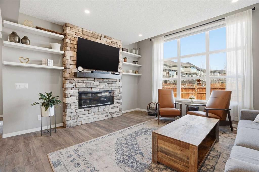 393 Masters Avenue Se, Calgary, AB - Indoor Photo Showing Living Room With Fireplace