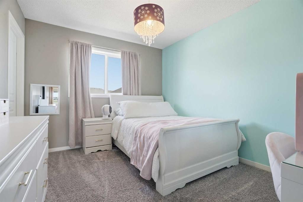 393 Masters Avenue Se, Calgary, AB - Indoor Photo Showing Bedroom