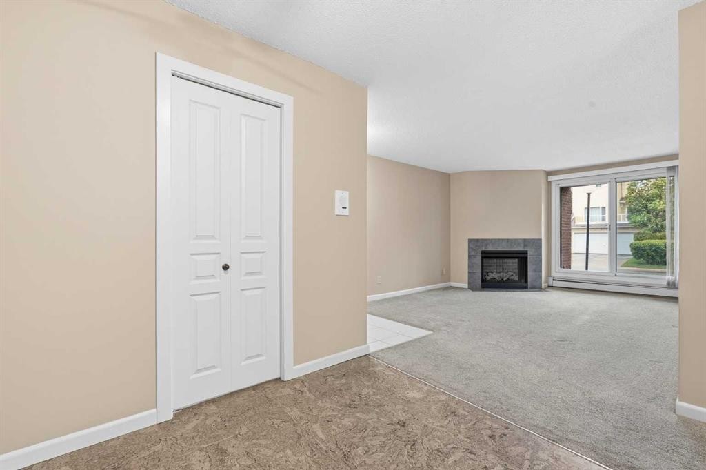 723-6400 Coach Hill Road Sw, Calgary, AB - Indoor With Fireplace