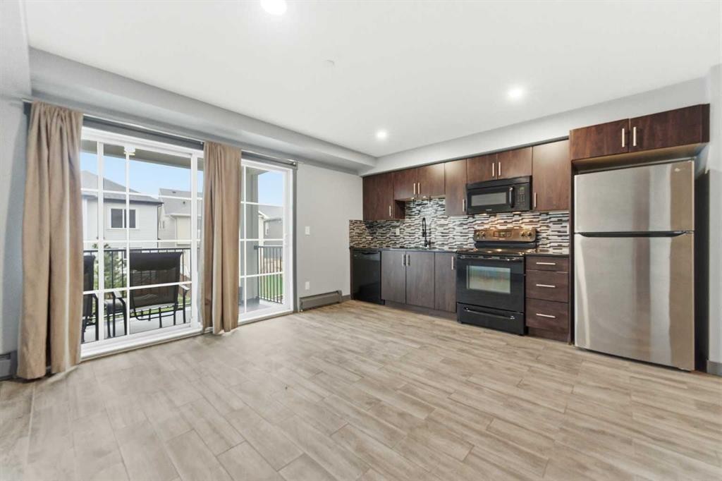 1204-755 Copperpond Boulevard Se, Calgary, AB - Indoor Photo Showing Kitchen With Stainless Steel Kitchen