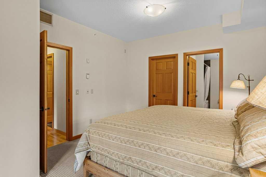 202-505 Spring Creek Drive, Canmore, AB - Indoor Photo Showing Bedroom