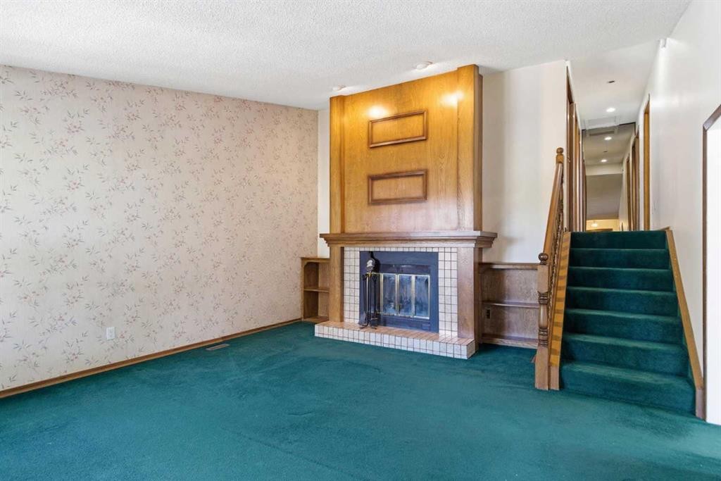 19 Templevale Way Ne, Calgary, AB - Indoor Photo Showing Other Room With Fireplace