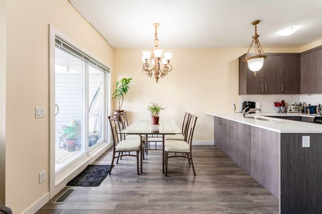 1402 Jumping Pound Common, Cochrane, AB - Indoor Photo Showing Dining Room