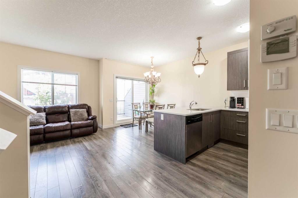 1402 Jumping Pound Common, Cochrane, AB - Indoor Photo Showing Living Room