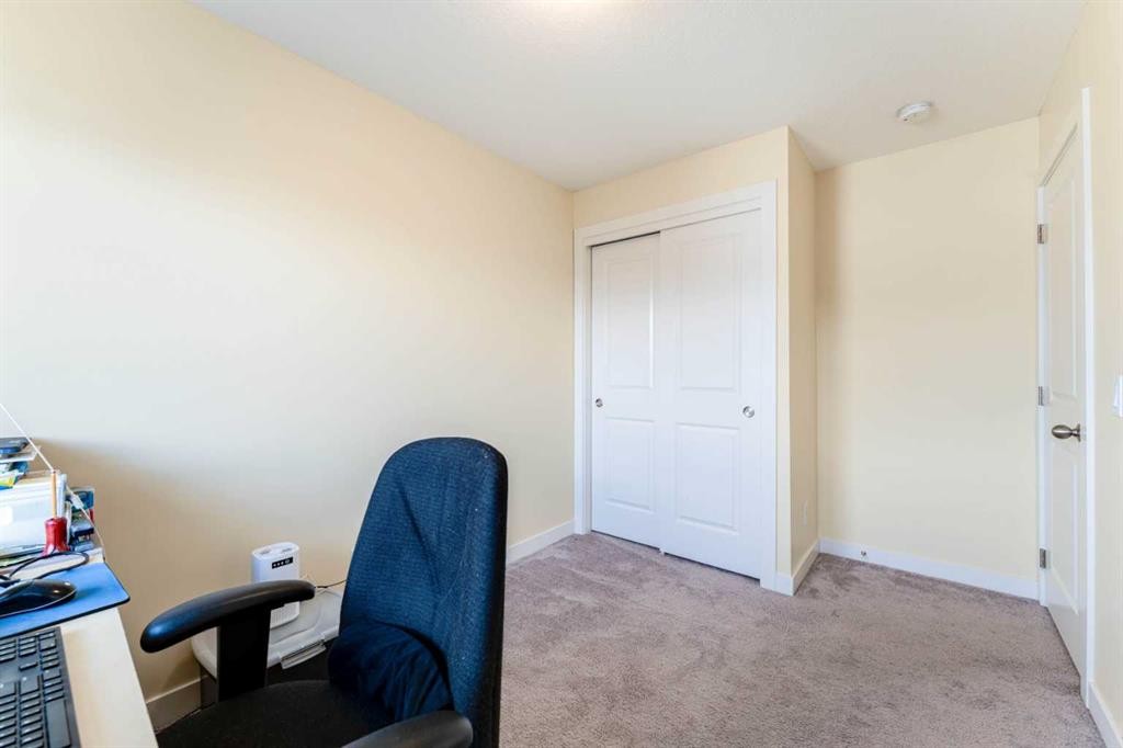 1402 Jumping Pound Common, Cochrane, AB - Indoor Photo Showing Other Room
