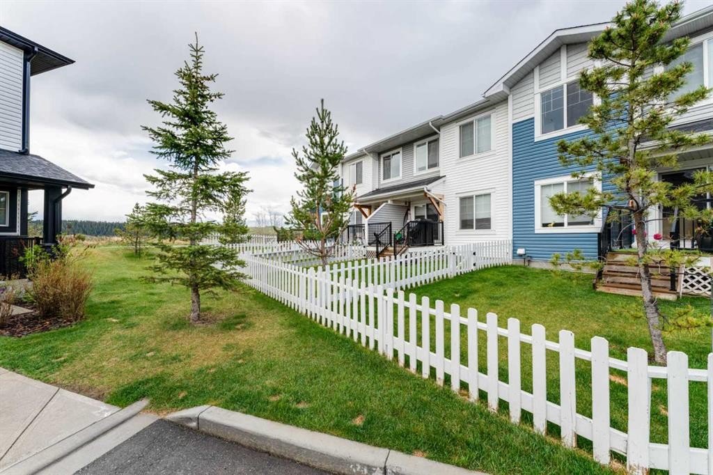 1402 Jumping Pound Common, Cochrane, AB - Outdoor With Facade