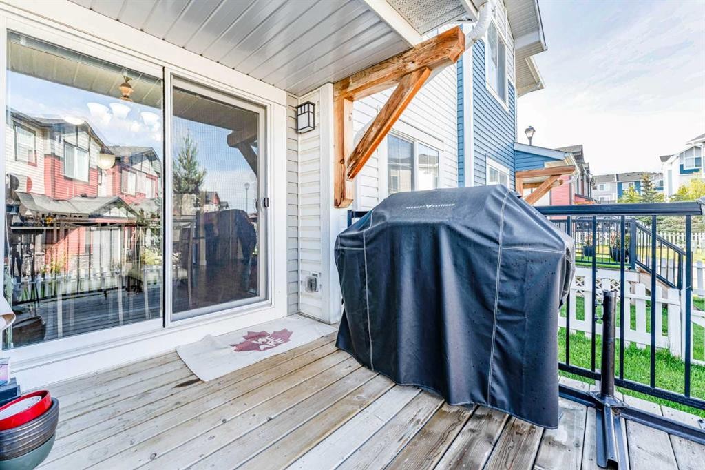 1402 Jumping Pound Common, Cochrane, AB - Outdoor With Deck Patio Veranda With Exterior
