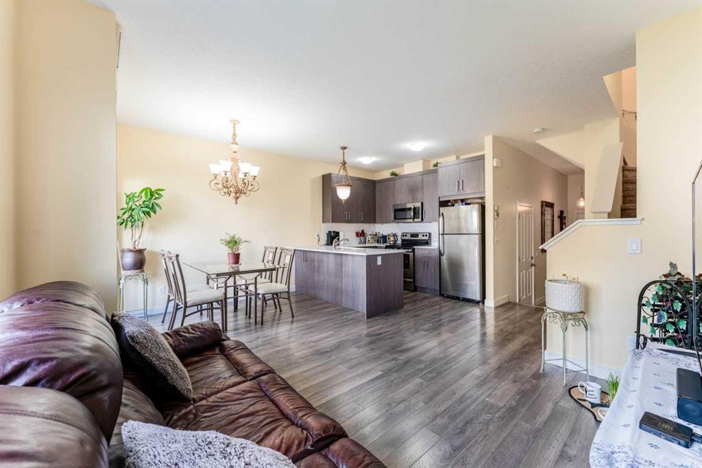 1402 Jumping Pound Common, Cochrane, AB - Indoor Photo Showing Kitchen With Stainless Steel Kitchen