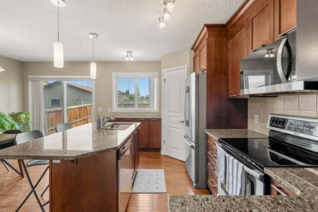 249 Elgin Meadows Park Se, Calgary, AB - Indoor Photo Showing Kitchen With Stainless Steel Kitchen With Double Sink With Upgraded Kitchen