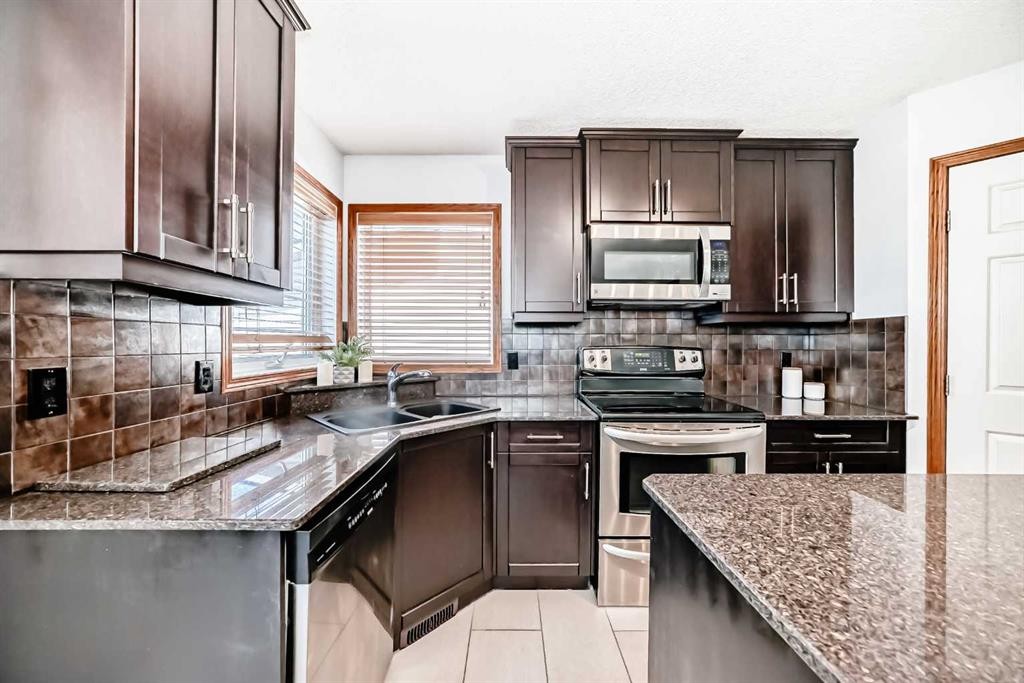 263 Coral Keys Drive Ne, Calgary, AB - Indoor Photo Showing Kitchen With Double Sink
