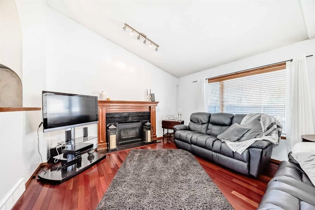 263 Coral Keys Drive Ne, Calgary, AB - Indoor Photo Showing Living Room With Fireplace