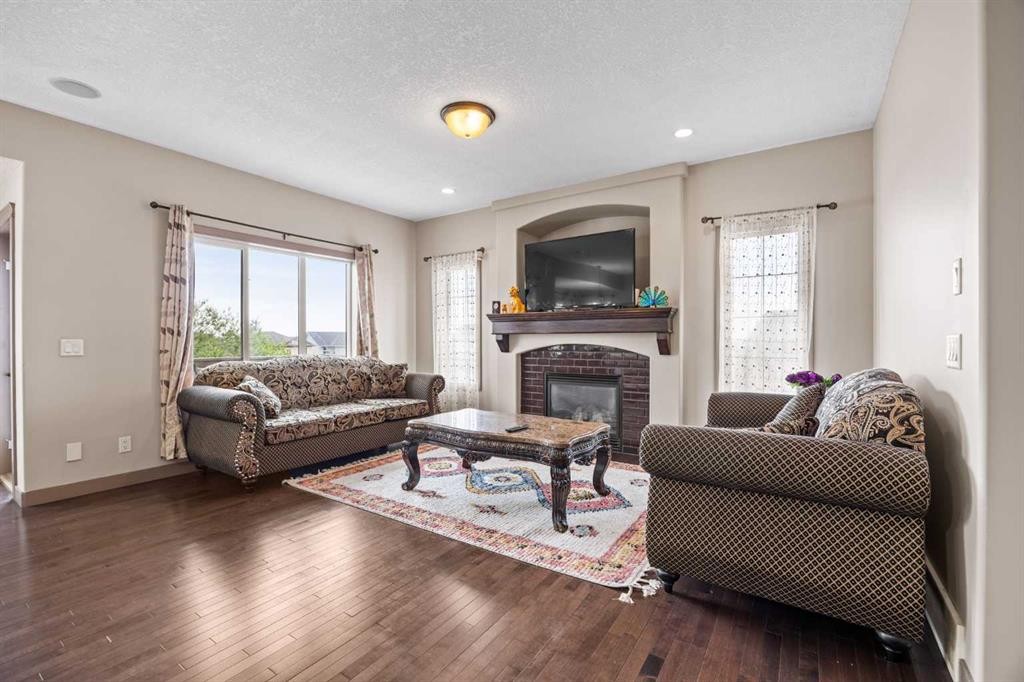 282 Pantego Terrace Nw, Calgary, AB - Indoor Photo Showing Living Room With Fireplace