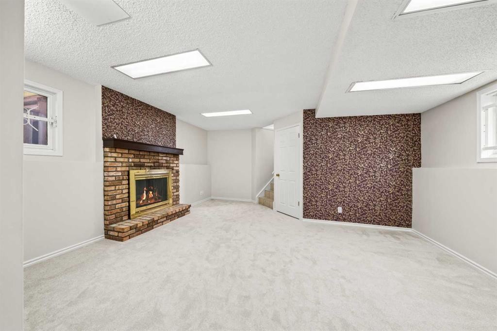 107 Tararidge Close Ne, Calgary, AB - Indoor With Fireplace